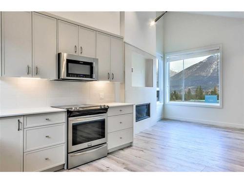 64-209 Stewart Creek Rise, Canmore, AB - Indoor Photo Showing Kitchen With Upgraded Kitchen