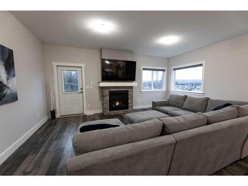 28-214 Mcardell Drive, Hinton, AB - Indoor Photo Showing Living Room With Fireplace