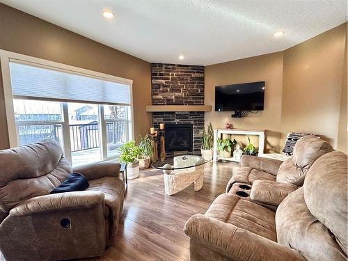 2 Rockhaven Way, Whitecourt, AB - Indoor Photo Showing Living Room With Fireplace