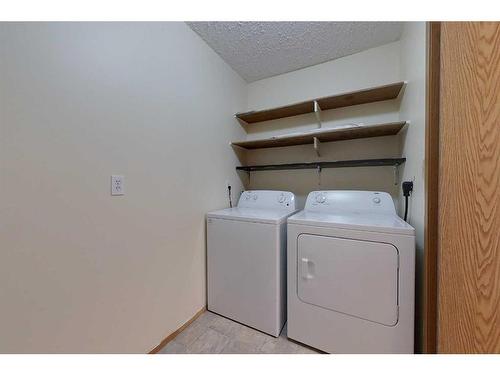 308-201 12 Avenue Sw, Slave Lake, AB - Indoor Photo Showing Laundry Room