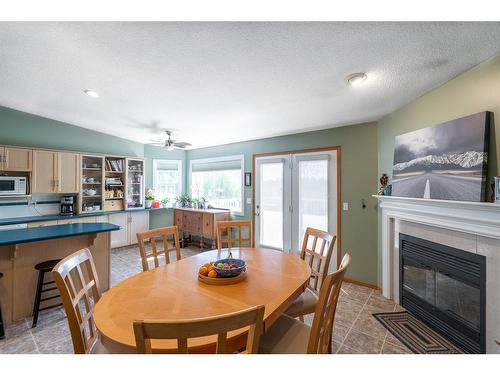 6 Pineview Road, Whitecourt, AB - Indoor Photo Showing Dining Room With Fireplace
