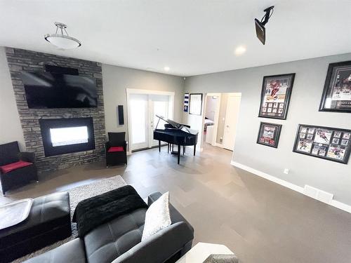 4714 Sakwatamau Drive, Whitecourt, AB - Indoor Photo Showing Living Room With Fireplace