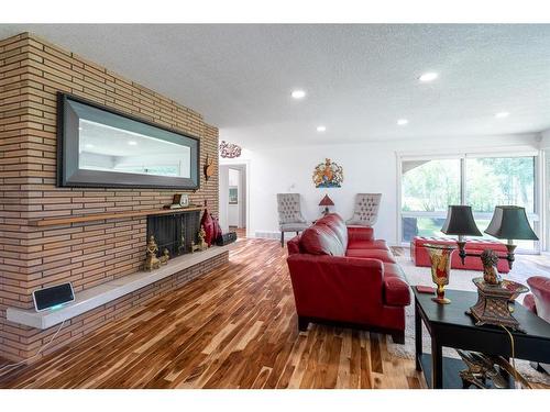 4704 Sakwatamau Drive, Whitecourt, AB - Indoor Photo Showing Living Room With Fireplace