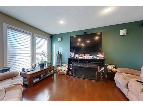 1105 9 Avenue Se, Slave Lake, AB - Indoor Photo Showing Living Room With Fireplace