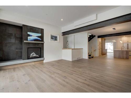 274 C&D Three Sisters Drive, Canmore, AB - Indoor Photo Showing Living Room With Fireplace