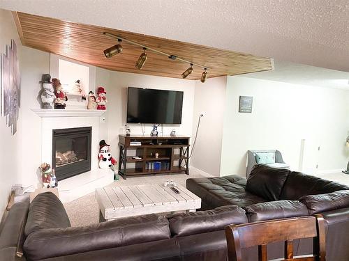 4716 56A Avenue, Whitecourt, AB - Indoor Photo Showing Living Room With Fireplace