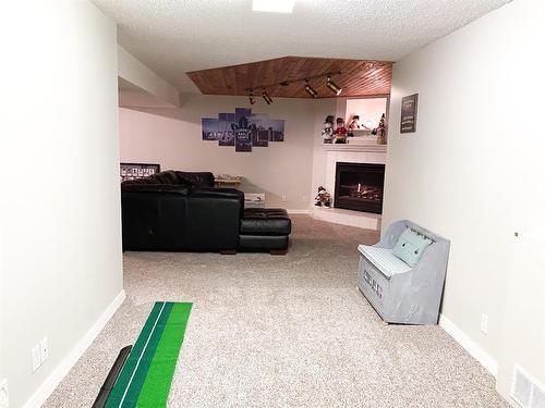 4716 56A Avenue, Whitecourt, AB - Indoor Photo Showing Other Room With Fireplace