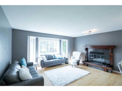 34 Ravine Drive, Whitecourt, AB - Indoor Photo Showing Living Room With Fireplace