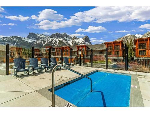 302-1105 Spring Creek Drive, Canmore, AB - Outdoor With In Ground Pool