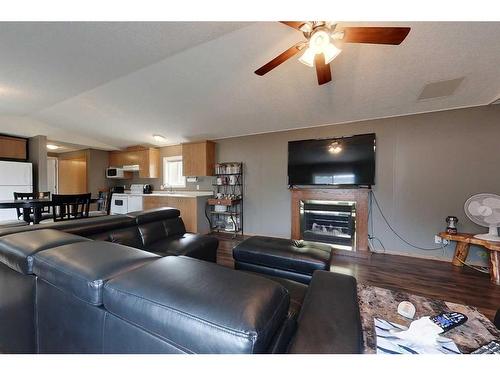2295 Waskway Drive, Wabasca, AB - Indoor Photo Showing Living Room With Fireplace