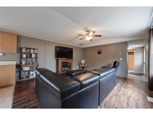 2295 Waskway Drive, Wabasca, AB - Indoor Photo Showing Living Room With Fireplace