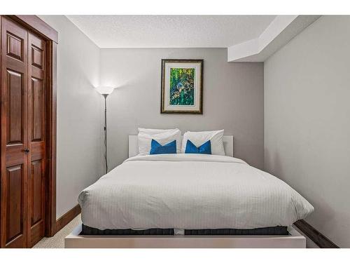 313-155 Crossbow Place, Canmore, AB - Indoor Photo Showing Bedroom
