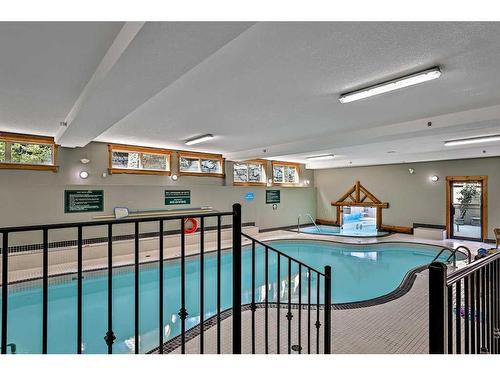 313-155 Crossbow Place, Canmore, AB - Indoor Photo Showing Other Room With In Ground Pool