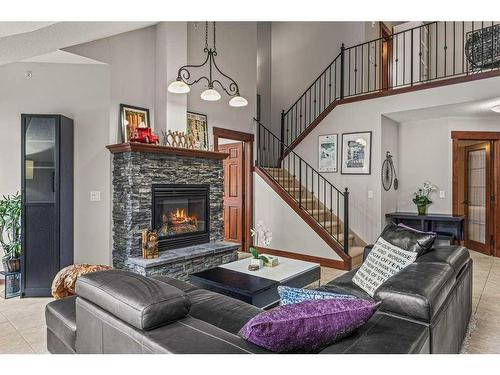 313-155 Crossbow Place, Canmore, AB - Indoor Photo Showing Living Room With Fireplace