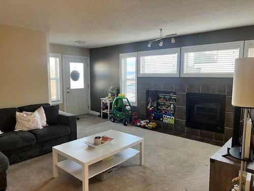 118 Moberly Road, Grande Cache, AB - Indoor Photo Showing Living Room With Fireplace