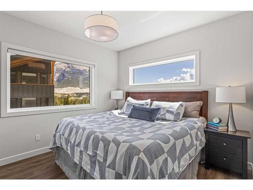 204I-209 Stewart Creek Rise, Canmore, AB - Indoor Photo Showing Bedroom