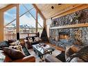 220 Eagle Point, Canmore, AB  - Indoor Photo Showing Living Room With Fireplace 