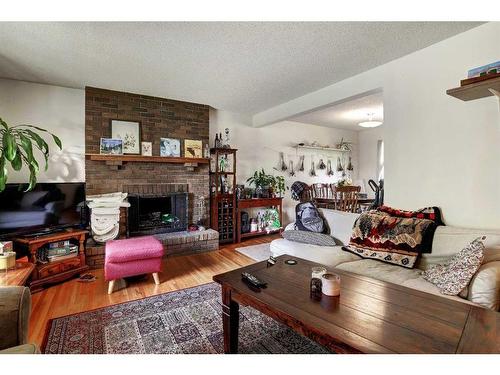 208 Otter Street, Banff, AB - Indoor Photo Showing Living Room With Fireplace