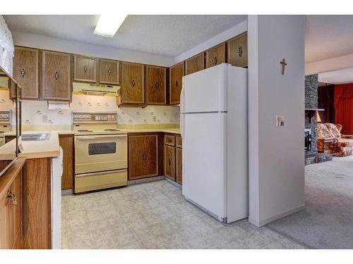 128 Nahanni Drive, Banff, AB - Indoor Photo Showing Kitchen With Double Sink