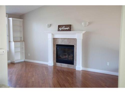 49 Skaggs Crossing, Whitecourt, AB - Indoor Photo Showing Other Room With Fireplace