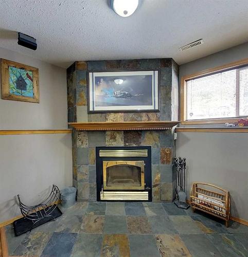90 Park Drive, Whitecourt, AB - Indoor With Fireplace