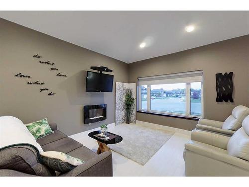 321 13 Street Se, Slave Lake, AB - Indoor Photo Showing Living Room With Fireplace