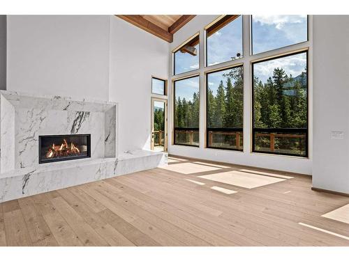 509 Stewart Creek Close, Canmore, AB - Indoor Photo Showing Living Room With Fireplace