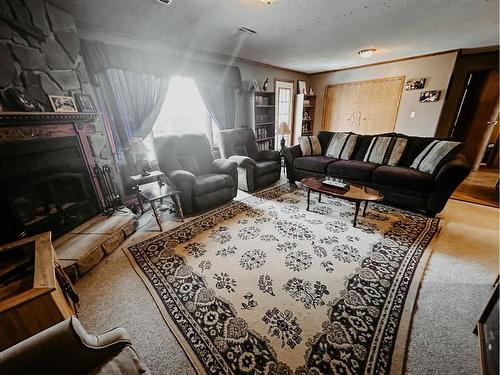 8 Park Drive, Whitecourt, AB - Indoor Photo Showing Living Room With Fireplace