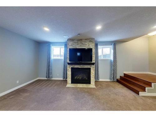 7111 South Glen Avenue, Edson, AB - Indoor Photo Showing Living Room With Fireplace