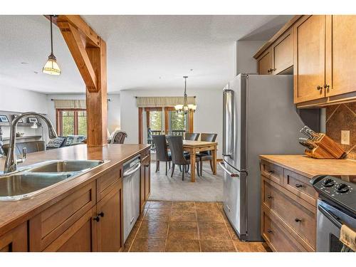 306-170 Crossbow Place, Canmore, AB - Indoor Photo Showing Kitchen With Double Sink