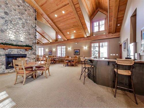 306-170 Crossbow Place, Canmore, AB - Indoor With Fireplace