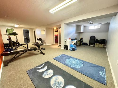 703 3 Avenue, Fox Creek, AB - Indoor Photo Showing Gym Room