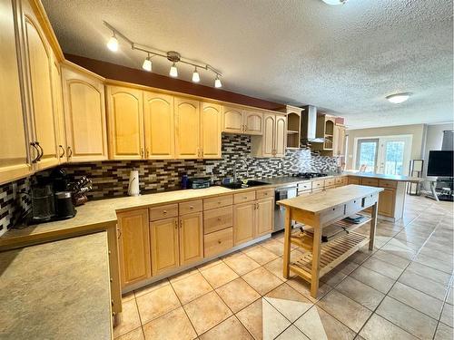 703 3 Avenue, Fox Creek, AB - Indoor Photo Showing Kitchen With Double Sink