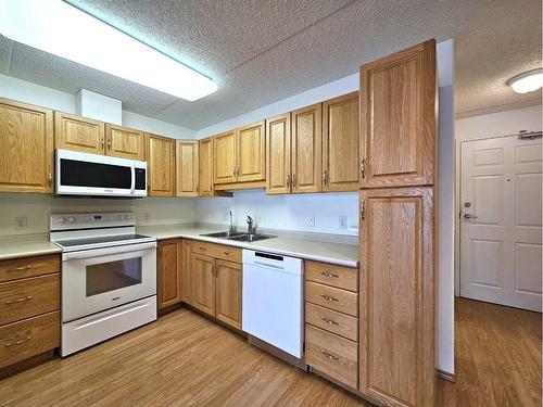 202-777 48 Street, Edson, AB - Indoor Photo Showing Kitchen With Double Sink