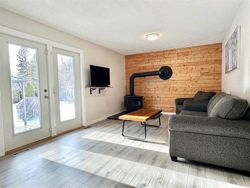 63 Chickadee Drive, Whitecourt, AB - Indoor Photo Showing Living Room With Fireplace