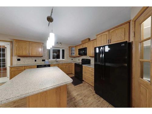 16 Springwood Ne, Slave Lake, AB - Indoor Photo Showing Kitchen With Double Sink