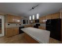 16 Springwood Ne, Slave Lake, AB  - Indoor Photo Showing Kitchen With Double Sink 