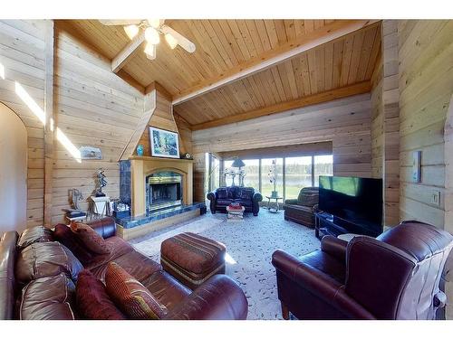 593002A Range Road 121, Rural Woodlands County, AB - Indoor Photo Showing Living Room With Fireplace