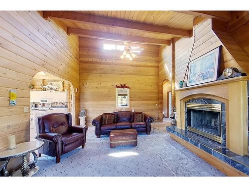 593002A Range Road 121, Rural Woodlands County, AB - Indoor Photo Showing Living Room With Fireplace