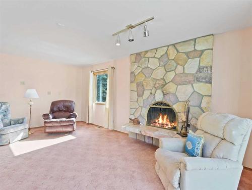 285 Grizzly Crescent, Canmore, AB - Indoor Photo Showing Living Room With Fireplace