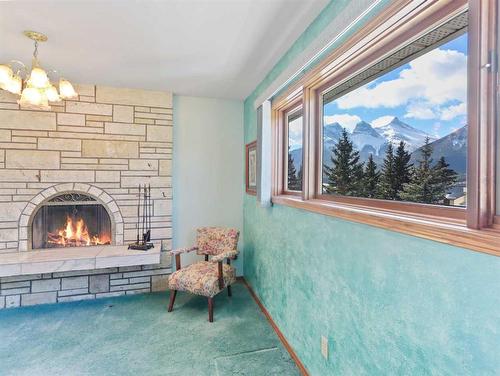 285 Grizzly Crescent, Canmore, AB - Indoor Photo Showing Other Room With Fireplace