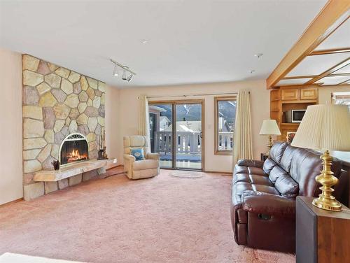 285 Grizzly Crescent, Canmore, AB - Indoor Photo Showing Living Room With Fireplace