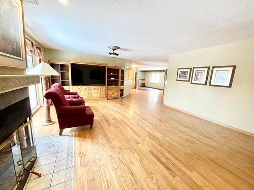210 Seabolt Estates, Rural Yellowhead County, AB - Indoor Photo Showing Living Room With Fireplace