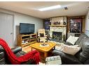 21 Chaisson Crossing, Whitecourt, AB  - Indoor Photo Showing Living Room With Fireplace 