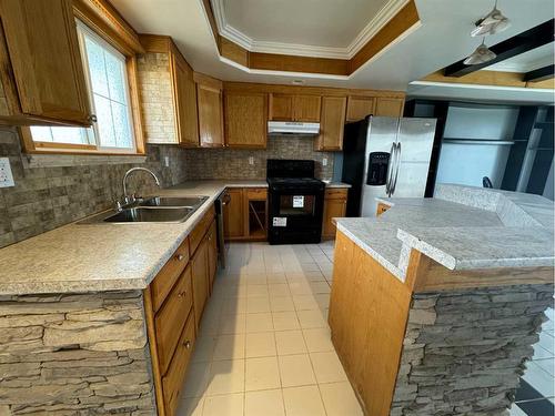 4220 Caribou Crescent, Wabasca, AB - Indoor Photo Showing Kitchen With Double Sink