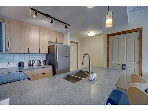213-190 Kananaskis Way, Canmore, AB - Indoor Photo Showing Kitchen With Double Sink