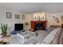 328 Squirrel Street, Banff, AB  - Indoor Photo Showing Living Room With Fireplace 