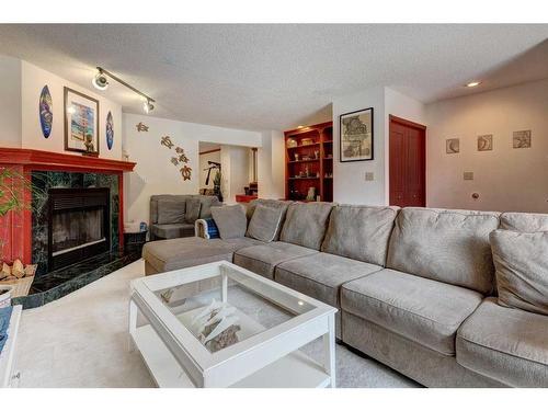 328 Squirrel Street, Banff, AB - Indoor Photo Showing Living Room With Fireplace