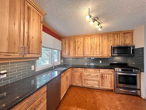 4910 44 Street, Athabasca, AB - Indoor Photo Showing Kitchen With Double Sink