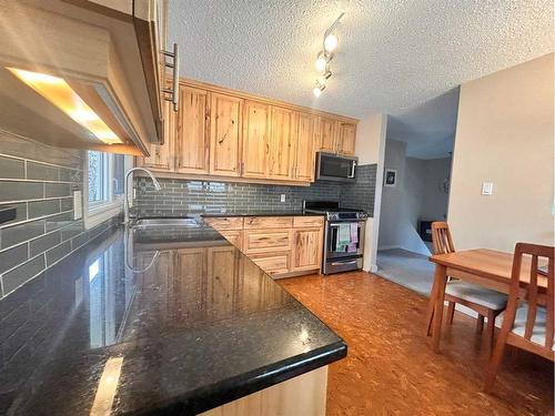 4910 44 Street, Athabasca, AB - Indoor Photo Showing Kitchen With Double Sink